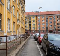 Česká Street in Bratislava - Nové Mesto with historic buildings and parked cars.