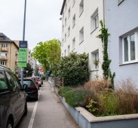 Česká Street in Bratislava - Nové Mesto with parked cars and urban greenery.