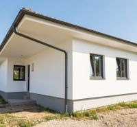 A family house on Pánska Niva in Hlohovec with a white facade and a gray roof.