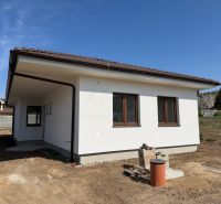 A family house on Pánska Niva in Hlohovec with a light facade and a brown roof.