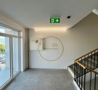The staircase of a residential building with an emergency exit, view of Košice - Západ district.