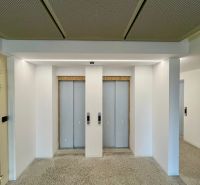 A corridor with two elevators, depicted in a 2-room apartment.