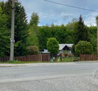 A family house on Levočská Street in Stará Ľubovňa surrounded by greenery and trees.
