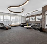 Living room with a sofa set, an armchair, and interesting lighting in a 4-room apartment.