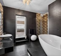 Luxury bathroom with a freestanding bathtub and decorative tiles in a 4-room apartment.