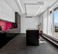 A stylish kitchen with colorful tiles and large windows in a 4-room apartment.