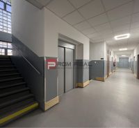 Hallway with stairs, elevator, and gray walls in the building Warehouses and Halls.