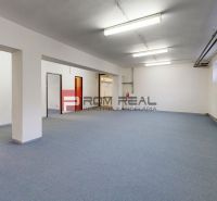 Spacious interior with neutral walls and flooring in warehouses and halls.