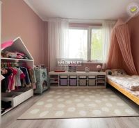 Children's room in a 3-room apartment with a wooden decor floor and storage space.