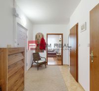 Hallway in a 3-room apartment with a dresser, a chair, and a coat rack.