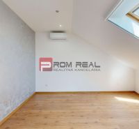 Interior of a family house with a wooden decor floor and a skylight.