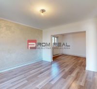 Interior of a family house with a wooden decor floor and light walls.