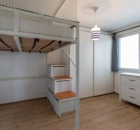 Children's room in a two-room apartment with a bunk bed and a floor with a wooden decor.