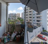 A balcony in a 2-room apartment on Kadnárova Street in Bratislava - Rača with a view of the parking lot.
