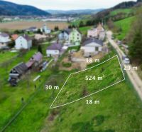 A residential plot in Rokytov with marked dimensions, surrounded by nature and houses.