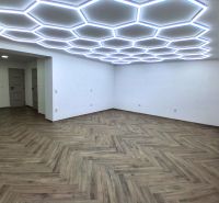 Commercial premises with unique lighting and wooden decor flooring.