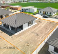 A family house in Hviezdoslavov with a large undeveloped plot and a black roof.