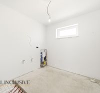 An empty room ready for renovation in a family house with white walls.