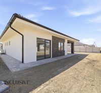 Family house in Hviezdoslavov with a terrace and a paved walkway on the property.