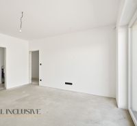 The interior of a family house with white walls and a large window without flooring.