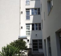 The facade of an apartment building with a garden in Bratislava - Nové Mesto on Vajnorská Street.