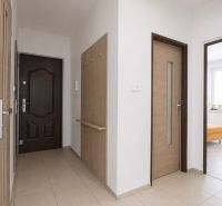 Entrance area of a 3-room apartment with tiles and a built-in wardrobe.