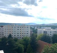 View from Drotárska cesta in Bratislava of residential buildings and nature.