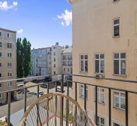A balcony with a view of the courtyard and neighboring buildings in Bratislava - Old Town on Grösslingova.