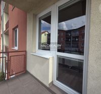 The balcony in the 2-room apartment in Pezinok offers a view of the neighboring buildings.