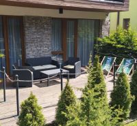 In the recreational apartment in Demänová on Demänová Street, there is a terrace with comfortable seating.