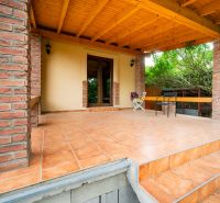The terrace of a family house on Kpt. Jaroša in Trenčín with brick cladding and a wooden ceiling.