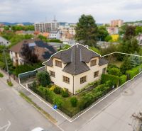A family house on Kpt. Jaroš Street in Trenčín with an adjacent garden and a fence.