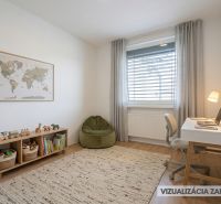 Children's room in a family house with a wooden decor floor, a desk, and a world map.