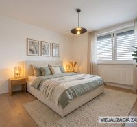 Bedroom in a family house with green accents and wood-patterned flooring.