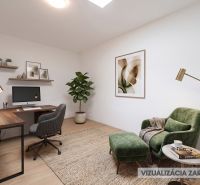 Office in a family house with a wooden decor floor, green chair, and work desk.