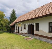 A family house in Cerová surrounded by greenery, suitable for residential land.