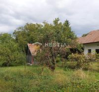 A family house surrounded by greenery in Cerová on a plot designated for residential use.