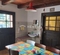 Interior with wood paneling and a colorful tablecloth, bathroom sink. Properties - living.