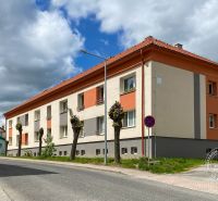 Apartment building on Obrancov Mieru Street in Stará Ľubovňa under a cloudy sky.