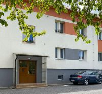 Apartment building on Obrancov Mieru Street in Stará Ľubovňa, with parking spaces.
