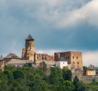 Ruins of a castle with forests in the background, an ideal scenery for life on Tatranská street.