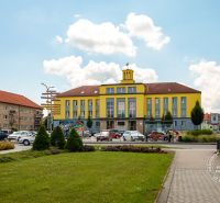 Roundabout in Stará Ľubovňa on Okružná Street with a building in the background.