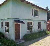 A cottage on Albaregia Street in Jahodná with a plastered facade and wooden doors.