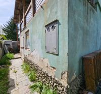 Cottage in Jahodná on Albaregia with damaged plaster and garden path.