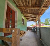 Wooden porch of the cottage on Albaregia Street in Jahodná with wooden railing.