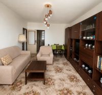 Living room in a 3-room apartment with a sofa and a coffee table.