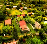 Aerial view of cottages surrounded by greenery in Košice - West district.