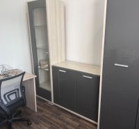 Office furniture with wood-decor flooring in a 3-room apartment.