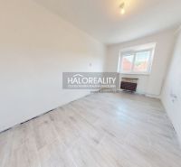 2-room apartment with wood-patterned flooring and white walls.