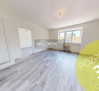 A bright room with a wooden decor floor in a 2-room apartment.